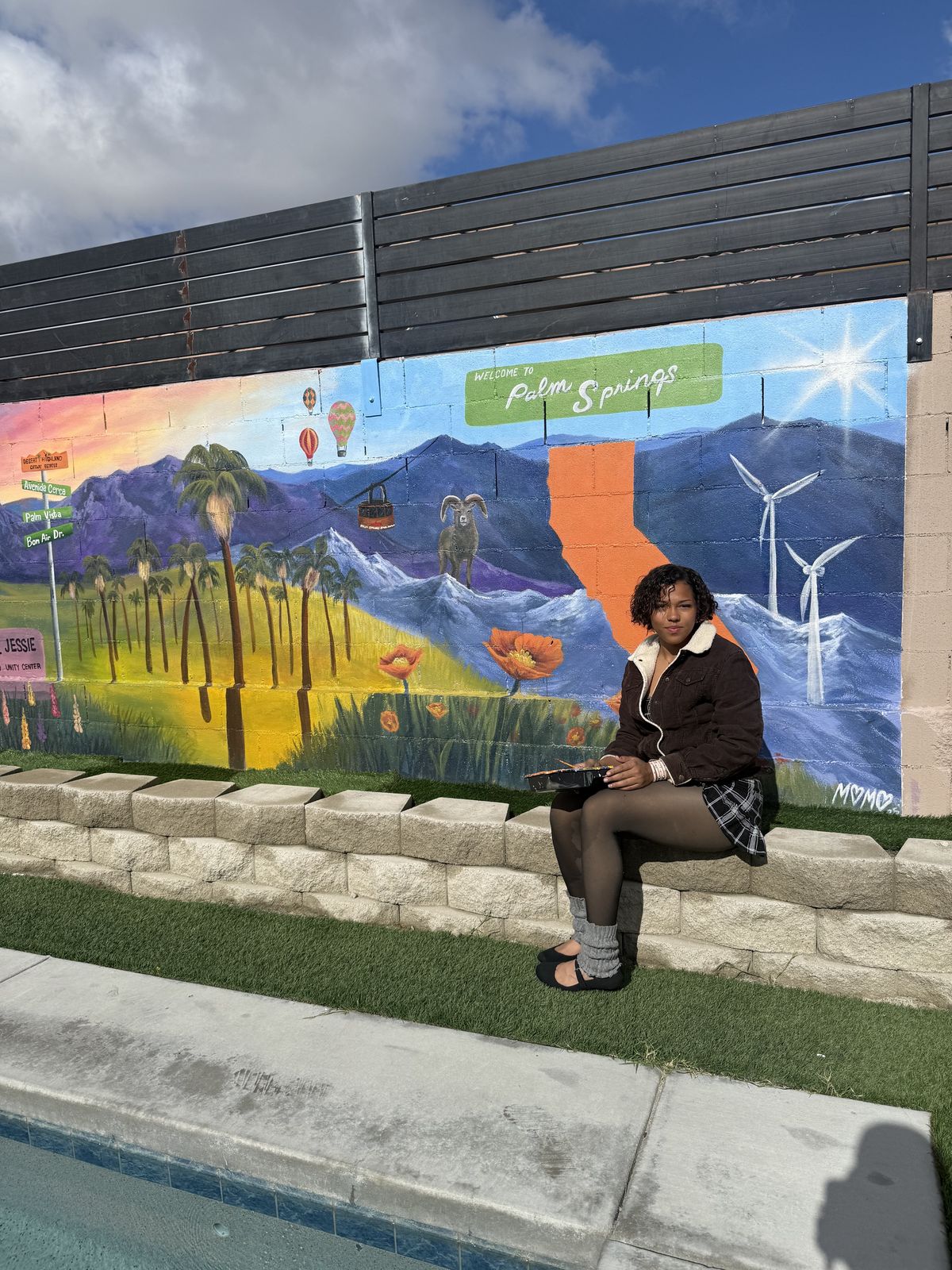 Welcome to Palm Springs mural with mountains, bighorn sheep, poppies and hot air balloons